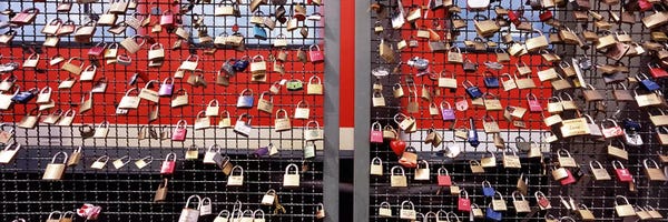 Cologne: Locks of Love on a fence, Hohenzollern Bridge, Cologne, North Rhine Westphalia, Germany by Panoramic Images