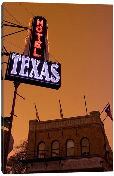 Low angle view of a neon sign of a hotel lit up at dusk, Fort Worth Stockyards, Fort Worth, Texas, USA Canvas Art Print - Signs