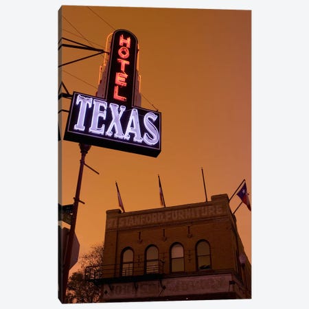 Low angle view of a neon sign of a hotel lit up at dusk, Fort Worth Stockyards, Fort Worth, Texas, USA Canvas Print #PIM8859} by Panoramic Images Canvas Wall Art