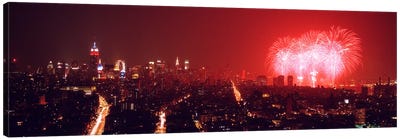 Fireworks display at night over a city, New York City, New York State, USA Canvas Art Print