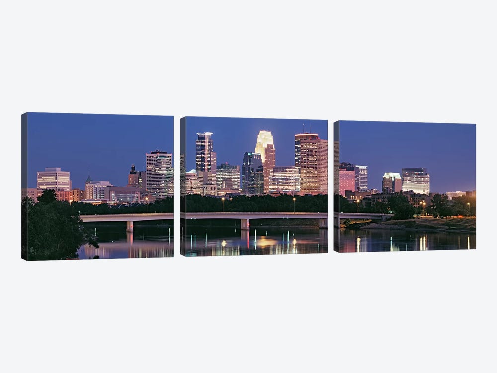 Buildings lit up at night in a city, Minneapolis, Mississippi River, Hennepin County, Minnesota, USA by Panoramic Images 3-piece Art Print