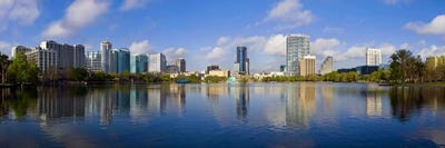 Reflection of buildings in a lake, Lake Eola, Orlando, Orange County, Florida, USA 2010 by Panoramic Images canvas print