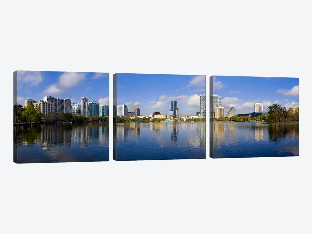 Reflection of buildings in a lake, Lake Eola, Orlando, Orange County, Florida, USA 2010 by Panoramic Images 3-piece Canvas Print