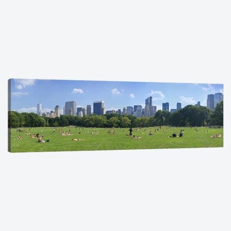 Tourists resting in a parkSheep Meadow, Central Park, Manhattan, New York City, New York State, USA Canvas Print #PIM9021} by Panoramic Images Canvas Artwork
