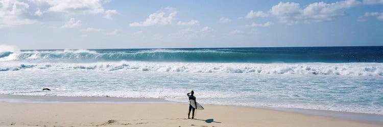 Surfer standing on the beachNorth Shore, Oahu, Hawaii, USA