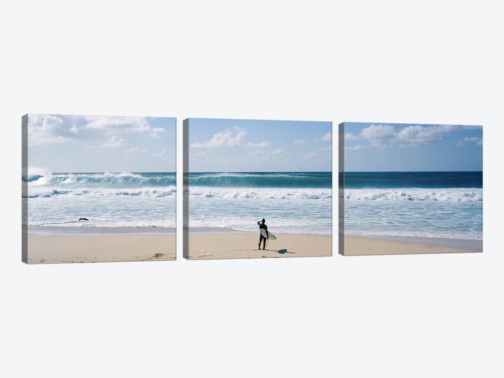 Surfer standing on the beachNorth Shore, Oahu, Hawaii, USA by Panoramic Images 3-piece Canvas Art