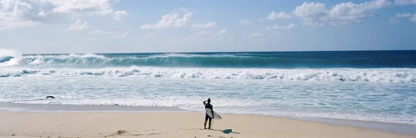 Large Photography - Canvas Prints: Surfer standing on the beachNorth Shore, Oahu, Hawaii, USA by Panoramic Images