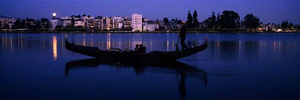 Boat in a lake with city in the background, Lake Merritt, Oakland, Alameda County, California, USA