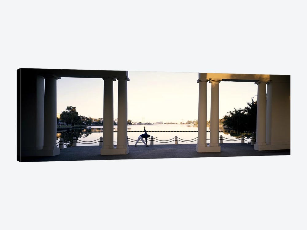 Person stretching near colonnade, Lake Merritt, Oakland, Alameda County, California, USA by Panoramic Images 1-piece Canvas Wall Art