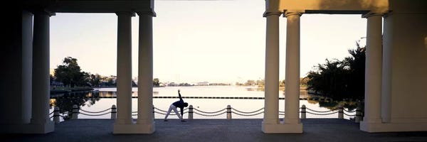 Oakland: Person stretching near colonnade, Lake Merritt, Oakland, Alameda County, California, USA by Panoramic Images