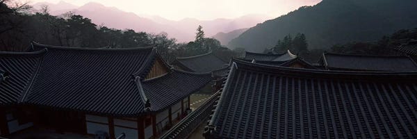 Buddhism: Buddhist temple with mountain range in the background, Kayasan Mountains, Haeinsa Temple, Gyeongsang Province, South Korea by Panoramic Images
