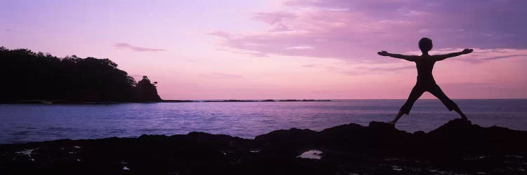 Rear view of a woman exercising on the coast, La Punta, Papagayo Peninsula, Costa Rica