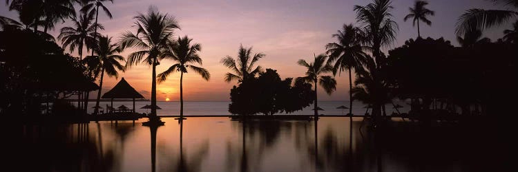 Sunset over hotel pool, Lombok, West Nusa Tenggara, Indonesia