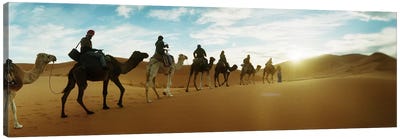 Tourists riding camels through the Sahara Desert landscape led by a Berber man, Morocco #2 Canvas Art Print - Desert Art