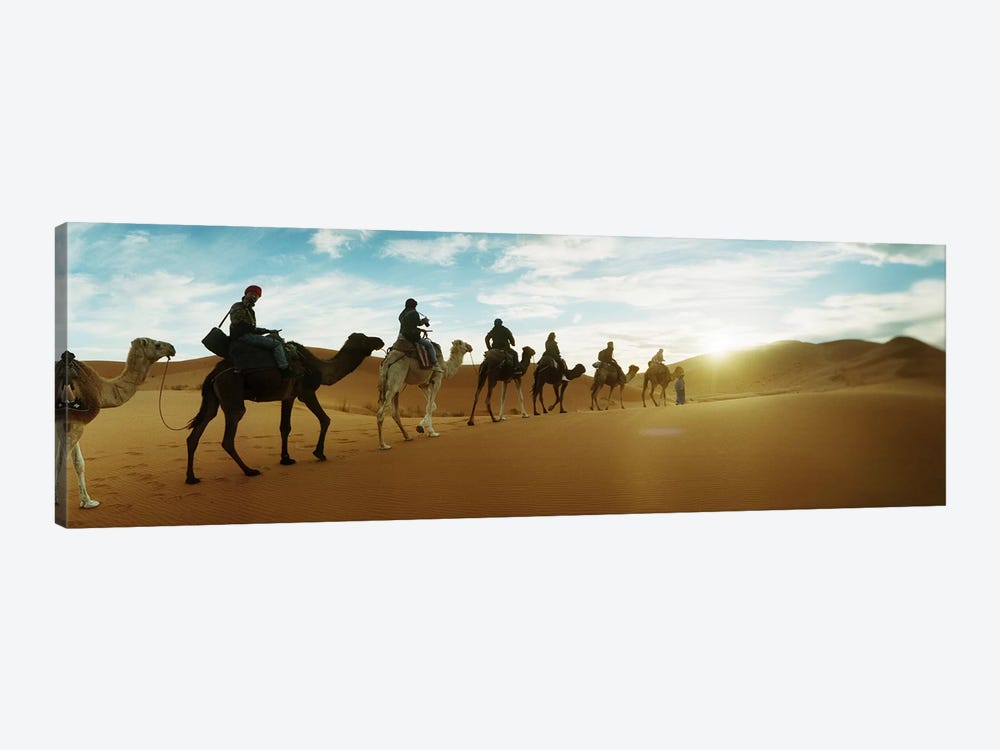 Tourists riding camels through the Sahara Desert landscape led by a Berber man, Morocco #2 by Panoramic Images 1-piece Canvas Art