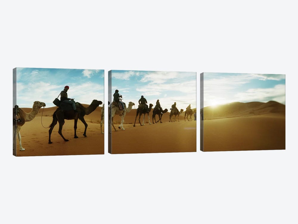 Tourists riding camels through the Sahara Desert landscape led by a Berber man, Morocco #2 by Panoramic Images 3-piece Canvas Art