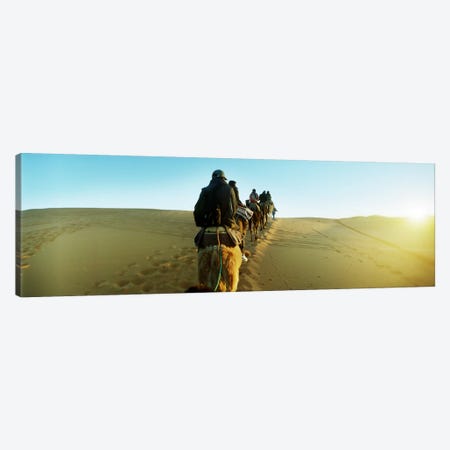 Row of people riding camels through the desert, Sahara Desert, Morocco Canvas Print #PIM9591} by Panoramic Images Canvas Art