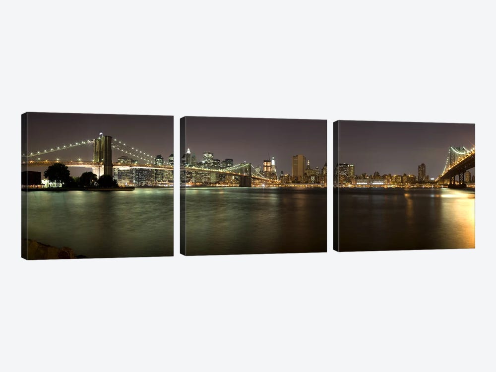 Brooklyn Bridge and Manhattan Bridge across East River at night, Manhattan, New York City, New York State, USA by Panoramic Images 3-piece Canvas Print