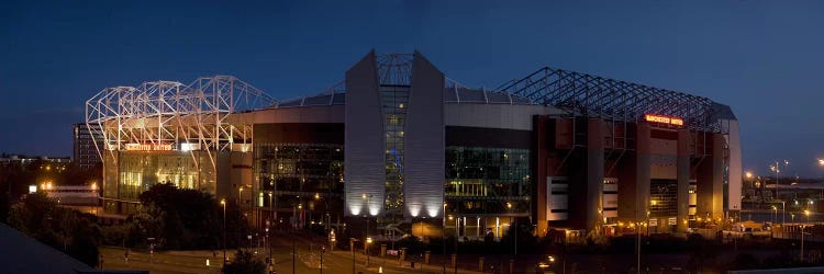 Football stadium lit up at night, Old Trafford, Greater Manchester, England