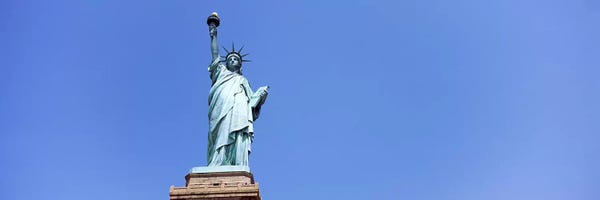 Statue Of Liberty: Low angle view of a statue, Statue Of Liberty, Liberty Island, New York City, New York State, USA by Panoramic Images