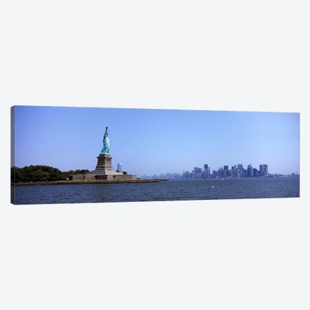 Statue Of Liberty with Manhattan skyline in the background, Liberty Island, New York City, New York State, USA 2011 Canvas Print #PIM9758} by Panoramic Images Canvas Art