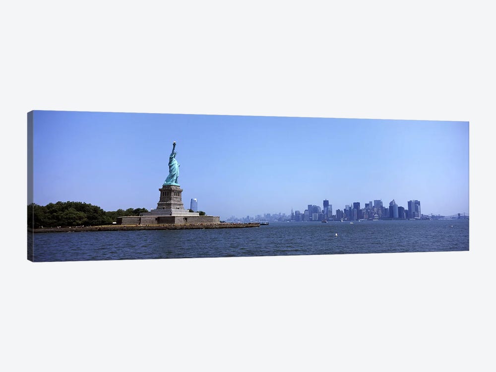 Statue Of Liberty with Manhattan skyline in the background, Liberty Island, New York City, New York State, USA 2011 by Panoramic Images 1-piece Art Print
