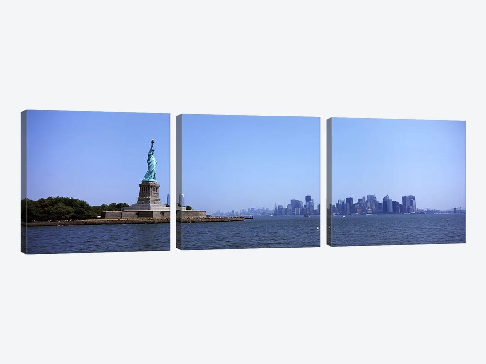 Statue Of Liberty with Manhattan skyline in the background, Liberty Island, New York City, New York State, USA 2011 by Panoramic Images 3-piece Canvas Art Print