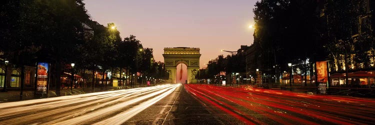 Blurred Motion View Of Nighttime Traffic On Avenue des Champs-Elysees Looking Toward Arc de Triomphe, Paris, France