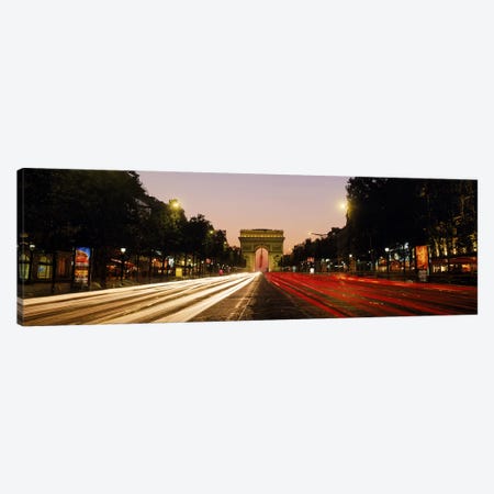 Blurred Motion View Of Nighttime Traffic On Avenue des Champs-Elysees Looking Toward Arc de Triomphe, Paris, France Canvas Print #PIM9771} by Panoramic Images Canvas Wall Art