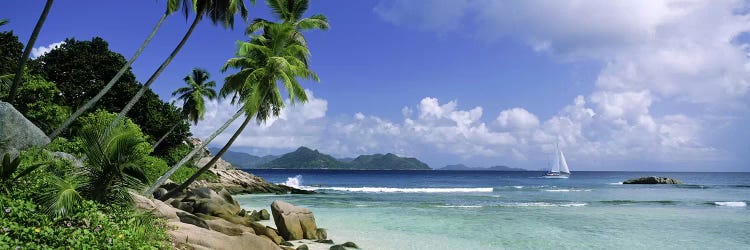 Coastal Landscape With A Distant View Of Praslin Island From Anse Severe Beach, La Digue, Seychelles