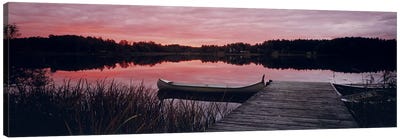 Canoe tied to dock on a small lake at sunset, Sweden Canvas Art Print - Canoe Art