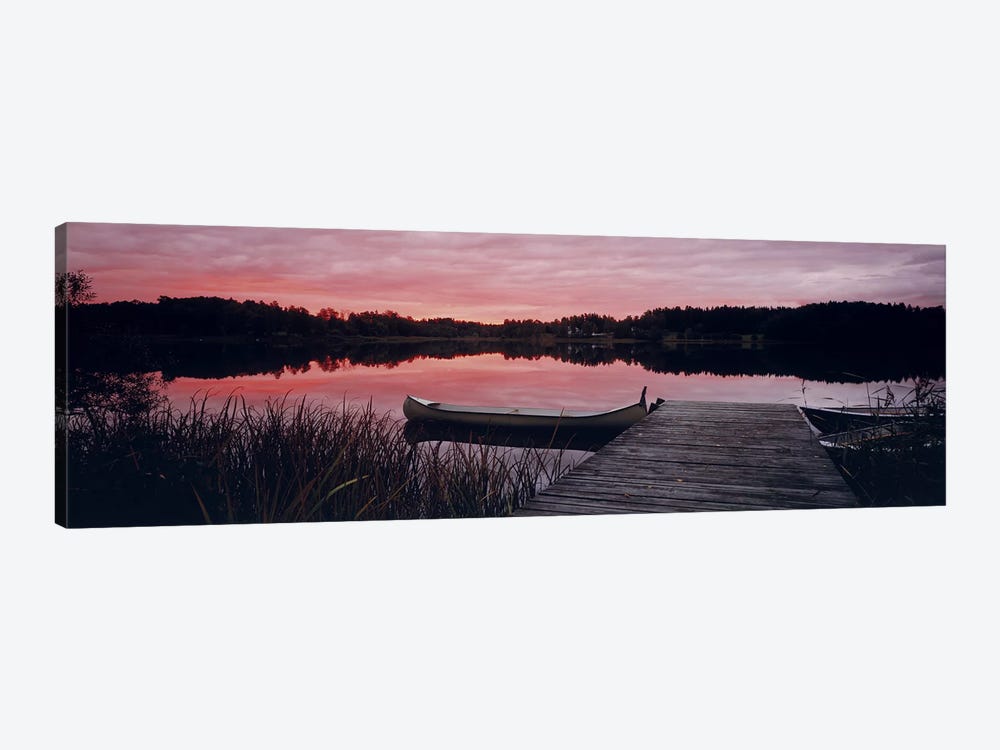 Canoe tied to dock on a small lake at sunset, Sweden by Panoramic Images 1-piece Canvas Wall Art