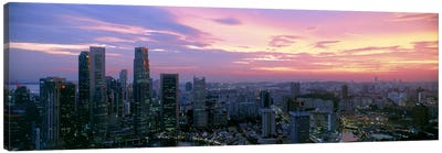 High angle view of a city at sunset, Singapore City, Singapore Canvas Art Print