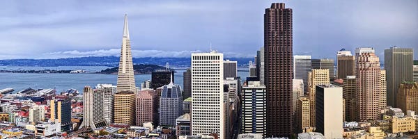 Oakland: Skyscrapers in the city with the Oakland Bay Bridge in the background, San Francisco, California, USA 2011 by Panoramic Images