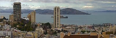 Buildings in a city with Alcatraz Island in San Francisco Bay, San Francisco, California, USA by Panoramic Images multi panel art