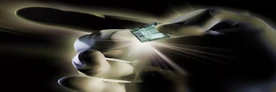 Close-up of a person's hand holding micro chip by Panoramic Images canvas print