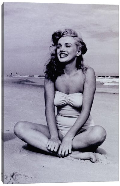 A Young, Smiling Marilyn Monroe Sitting On The Beach Canvas Art Print - Marilyn Monroe