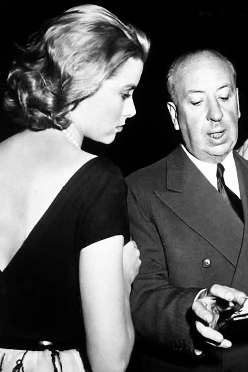 Grace Kelly Conversing With Alfred Hitchcock