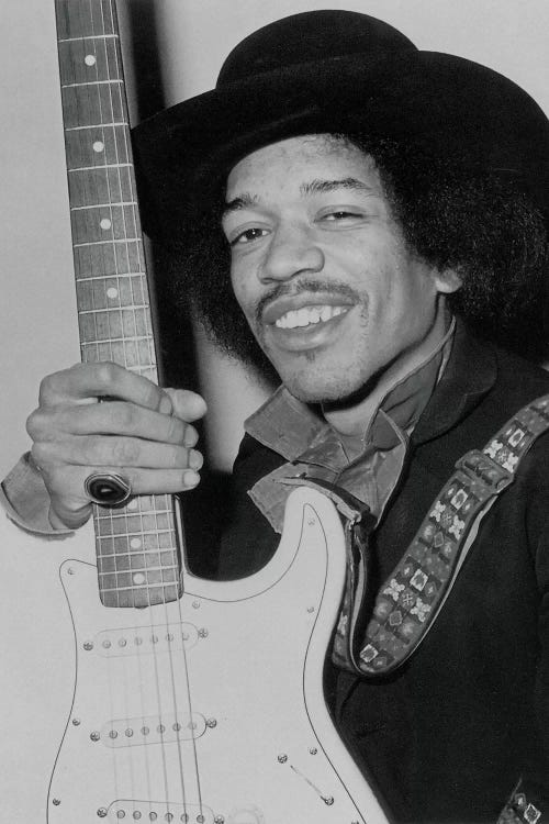 A Smiling Jimi Hendrix Holding His Guitar by Radio Days wall art