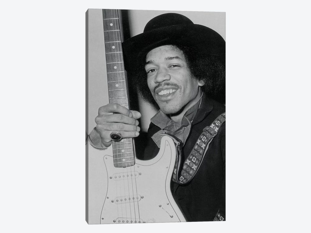 A Smiling Jimi Hendrix Holding His Guitar 1-piece Canvas Wall Art