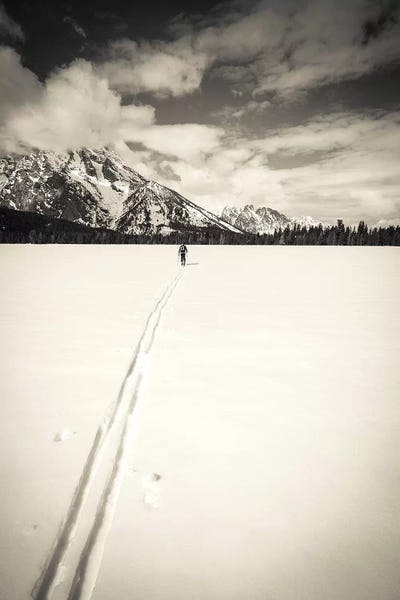Rocky Mountains: Backcountry skier under Mount Moran, Grand Teton National Park, Wyoming, USA  by Russ Bishop