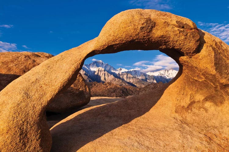 Dawn light on Mount Whitney through rock arch, Alabama Hills, Sequoia National Park, California