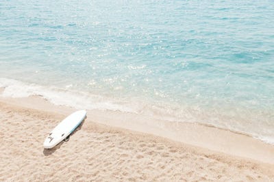 Aerial View Of Surf Board On Beach by Radu Bercan metal wall art