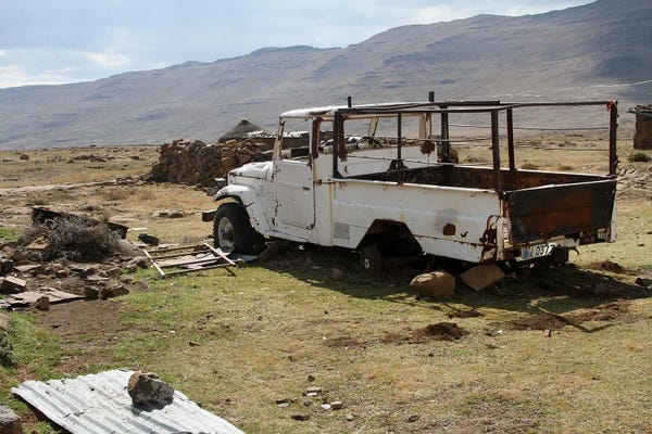 Ramona Heiner: Broken Car, Surrounded By Material, Used To Built The Rondavels - Sani Pass, Lesotho, Southern Africa by Ramona Heiner