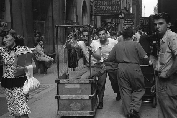 Ruth Orkin: Charles James Story Men Pushing Carts (NYC, 1949) by Ruth Orkin