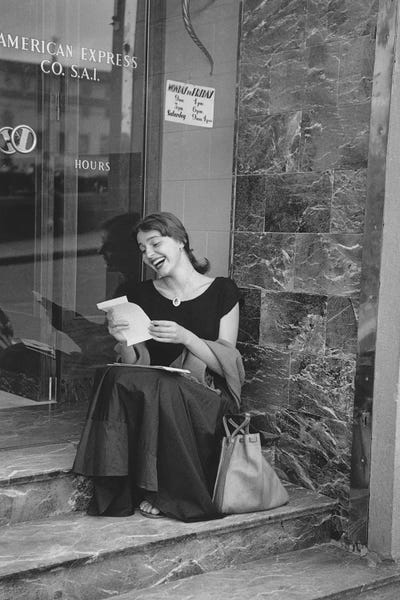 Ruth Orkin: American Girl Series At American Express Office (Florence, Italy 1951) by Ruth Orkin