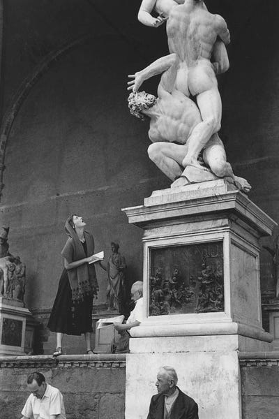 Ruth Orkin: American Girl Series Staring At Statue Florence, Italy 1951 by Ruth Orkin