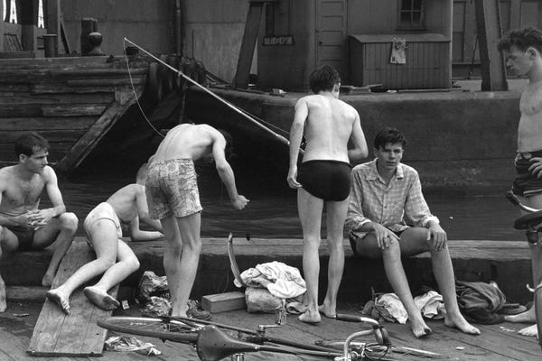 Ruth Orkin: Boys Fishing At Ganservoort Pier (1948) by Ruth Orkin
