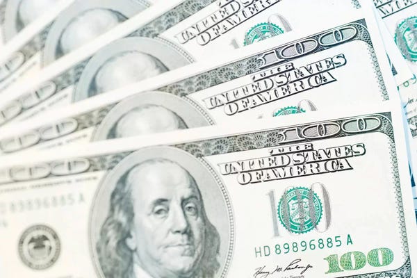 Benjamin Franklin: US Currency, $100 Bills (Selective Focus) by Rob Tilley