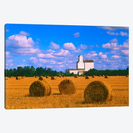 Straw Bales And Grain Elevator Canvas Print #RVD66} by Dave Reede Canvas Art Print